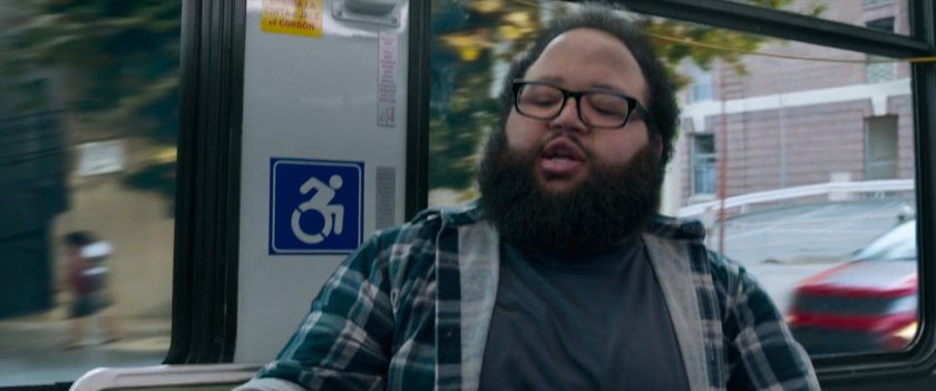 Reaction shot of passenger on a San Francisco metro bus.