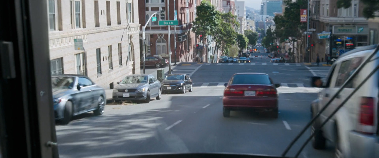 POV of upcoming San Francisco intersection.