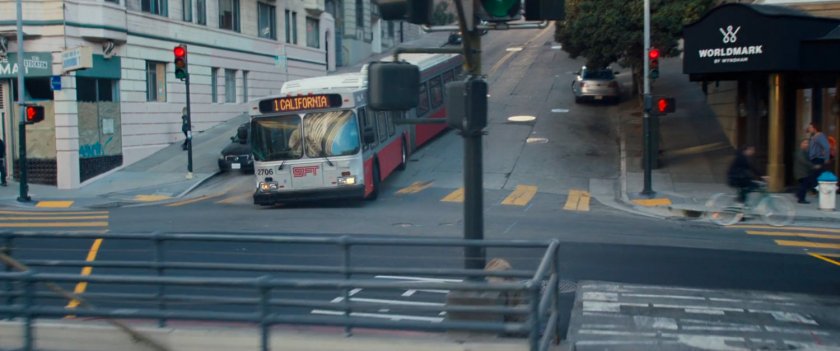 A bus makes a hard left at a San Francisco intersection.