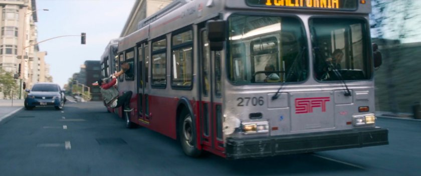 Shaun hangs on the outside of a San Francisco metro bus.