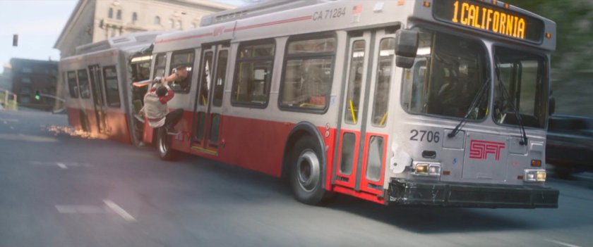 Shaun hangs on the outside of a San Francisco metro bus.