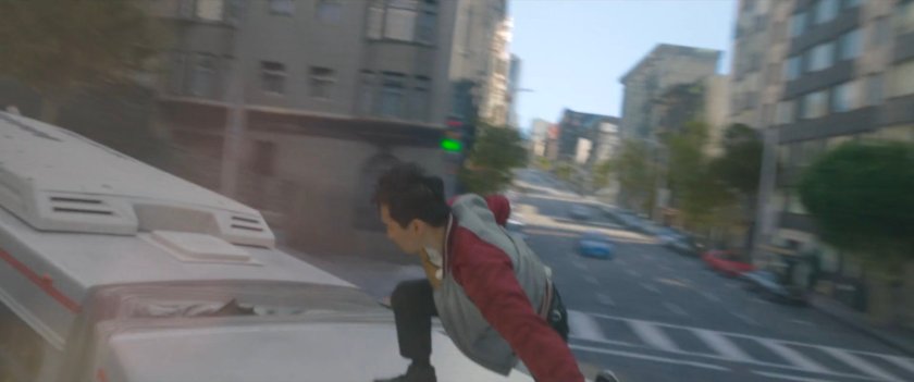 Shaun stands on the top of a San Francisco metro bus.