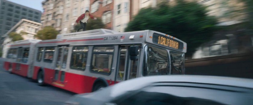 Shaun running on the top of a San Francisco metro bus.