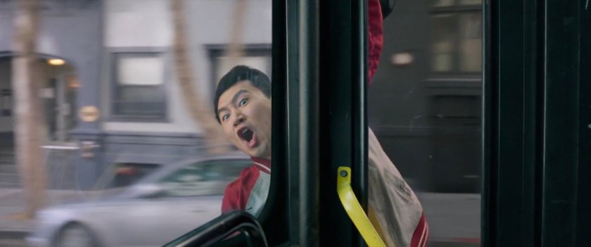 Shaun hanging outside the door of a San Francisco metro bus.