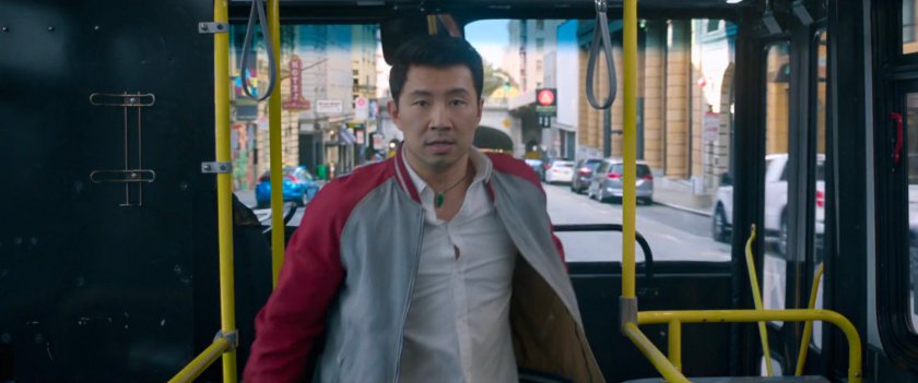 Shaun stands at the entrance of a San Francisco metro bus.