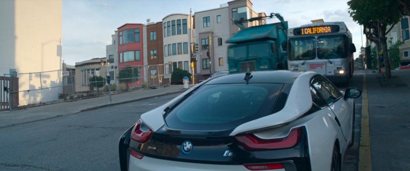 A San Francisco garbage truck and city bus bump against each other speeding down street.