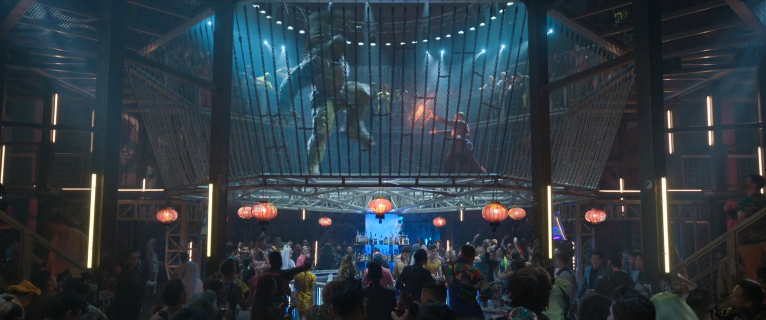 Interior of Golden Daggers club with giant cage featuring Wong fighting the Abomination.
