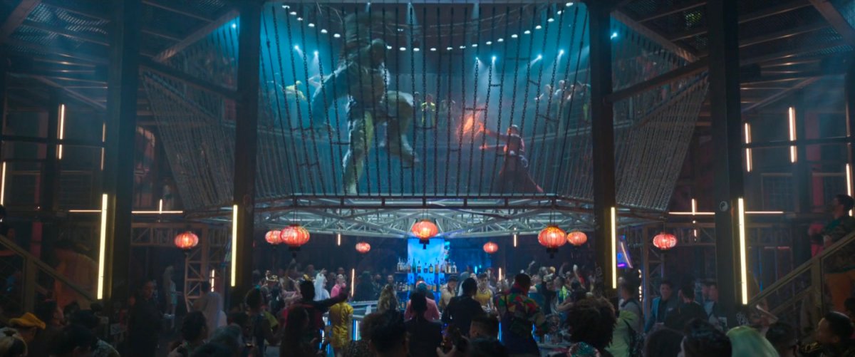 Interior of Golden Daggers club with giant cage featuring Wong fighting the Abomination.