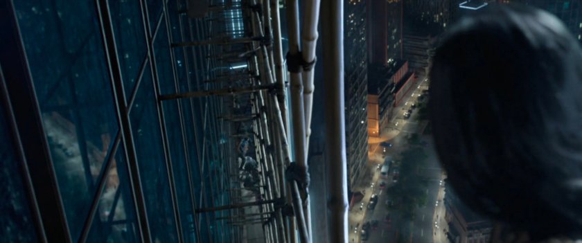People fighting on skyscraper scaffolding in Macau.