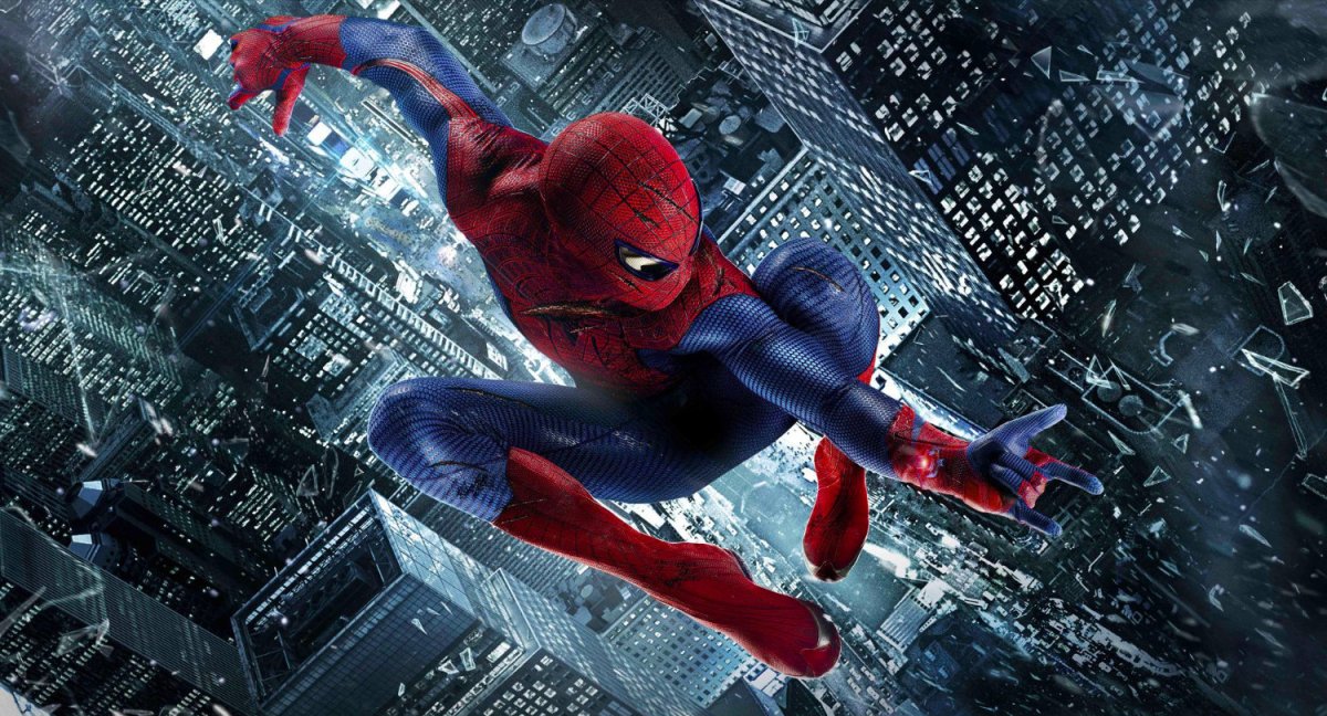 Spider-Man leaps acrobatically over New York City at night.