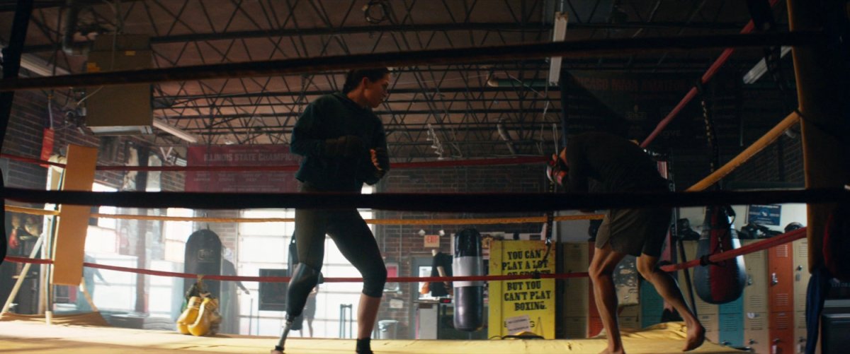 Maya boxing in a gym.