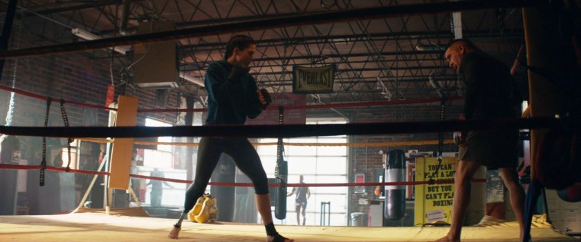 Maya boxing in a gym.