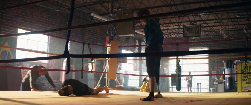 Maya boxing in a gym.