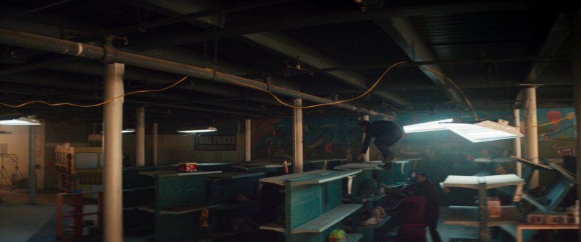 Clint evading the tracksuit mafia, running through an abandoned toy store.