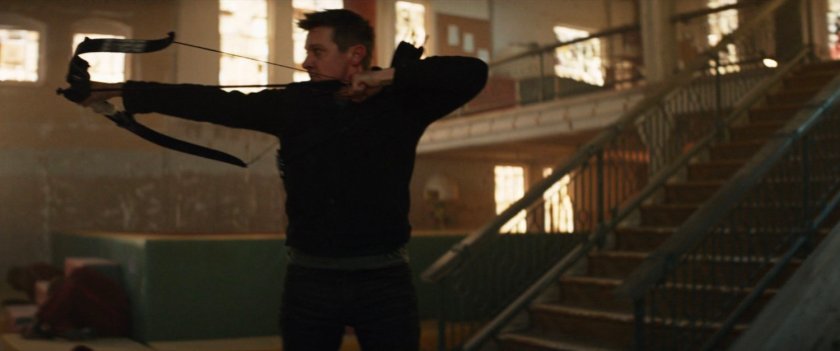 Clint firing arrows in an abandoned toy store.