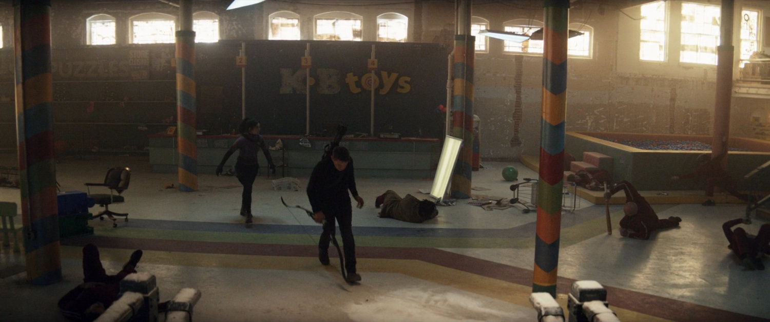 Kate and Clint leaving an abandoned toy store.