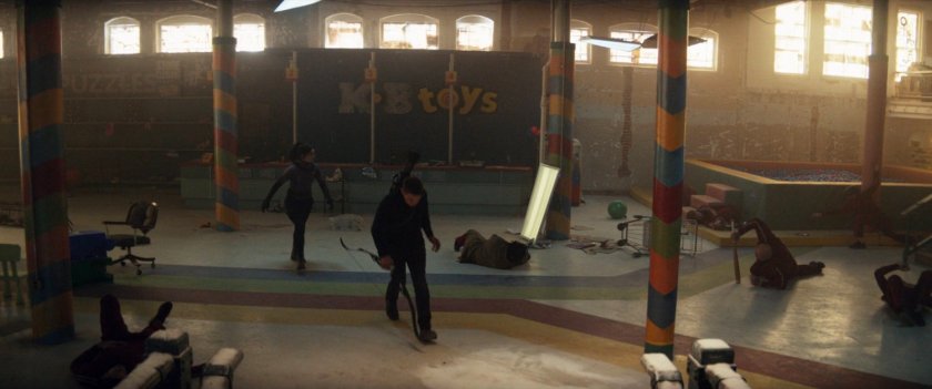 Kate and Clint leaving an abandoned toy store.