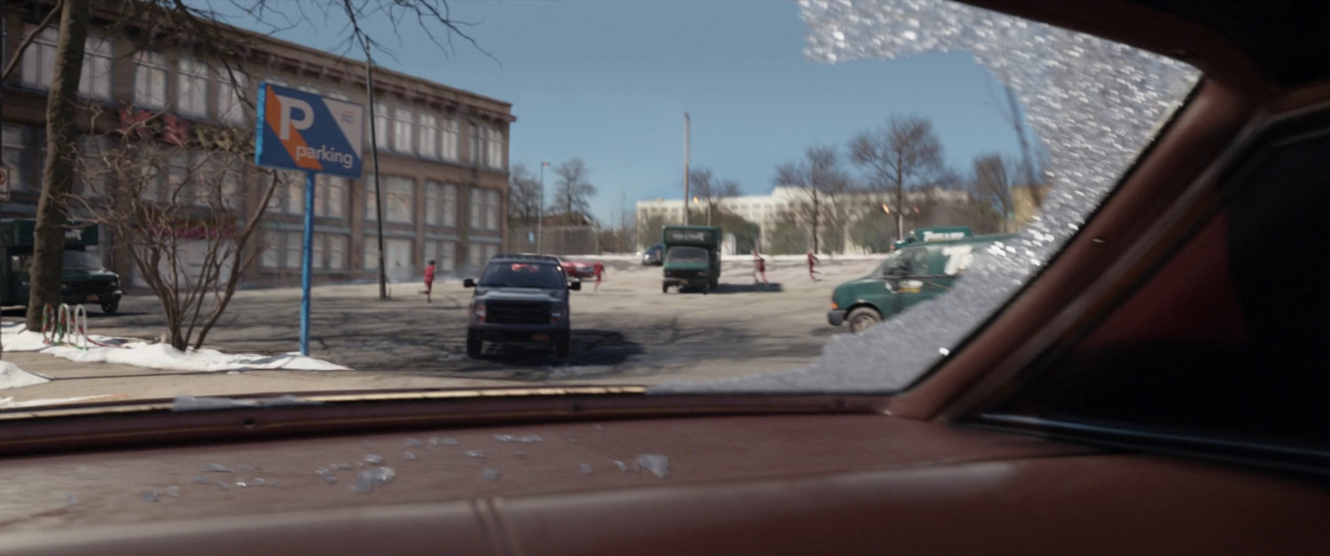 Tracksuit mafia pursue a fleeing car.