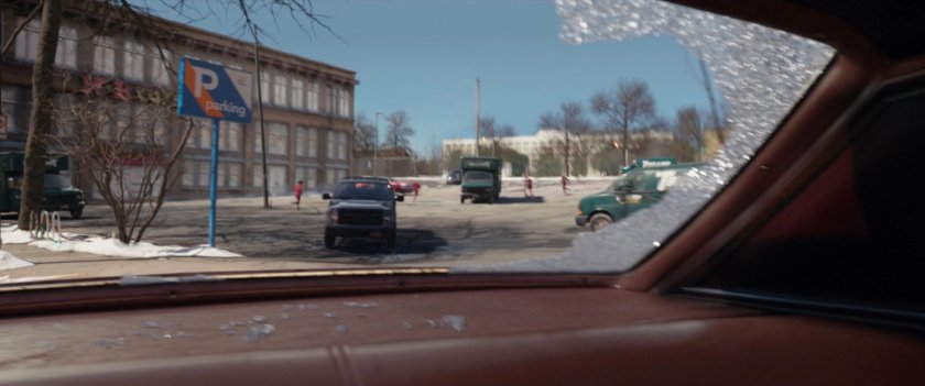 Tracksuit mafia pursue a fleeing car.