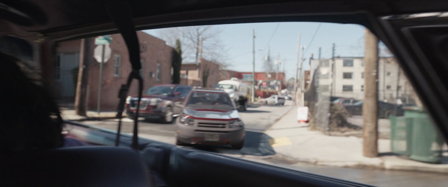 View of car chase from inside car.
