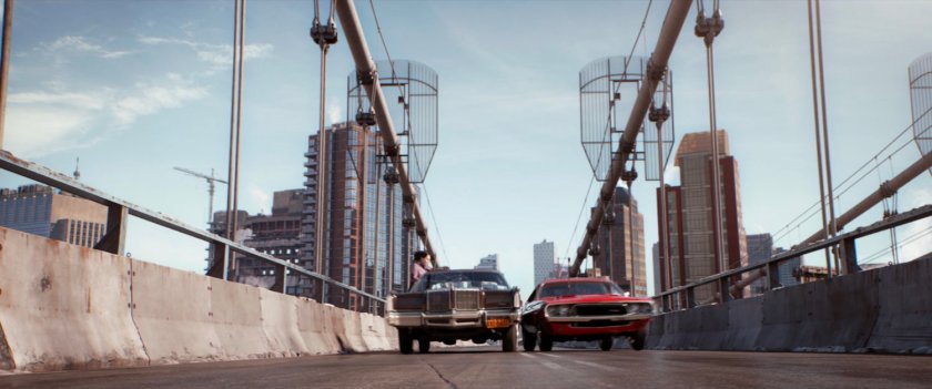 Two cars racing across Manhattan Bridge.