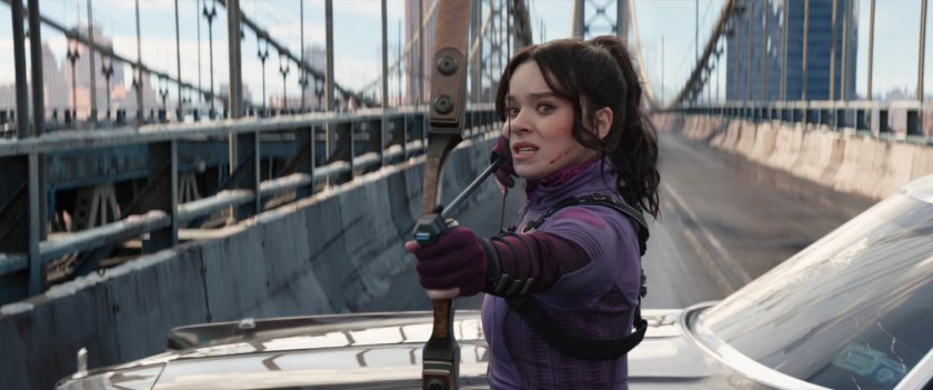 Kate firing an arrow on the Manhattan Bridge.