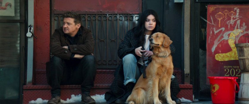 Clint, Kate and Lucky wait on a stoop in Chinatown.