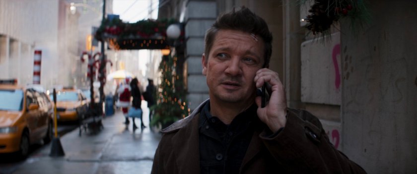 Clint talking on phone while walking on a New York sidewalk.