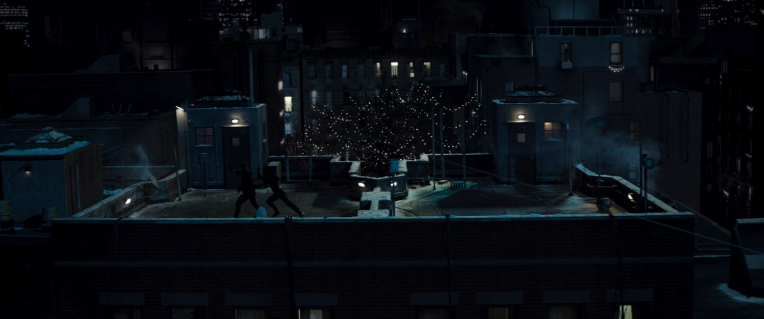 Clint and Yelena fight on rooftop across from Maya's apartment.