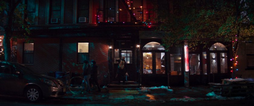 Nighttime exterior of Grills' apartment building.