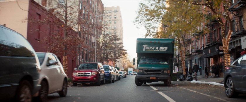 Trust-A-Bro van driving on New York street.