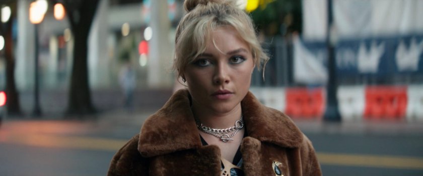 Yelena watching Eleanor walking on sidewalk outside of Kingpin's hotel.