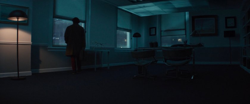 Kazi in dark office across the street from Rockefeller Center.