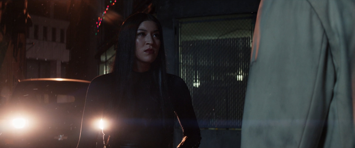 Maya confronts Fisk in a dark alley.