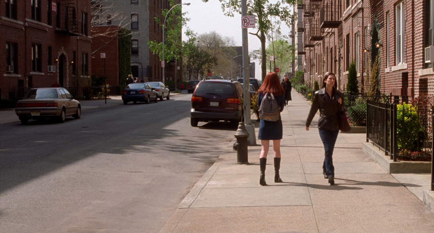 Mary Jane walking on sidewalk in New York.