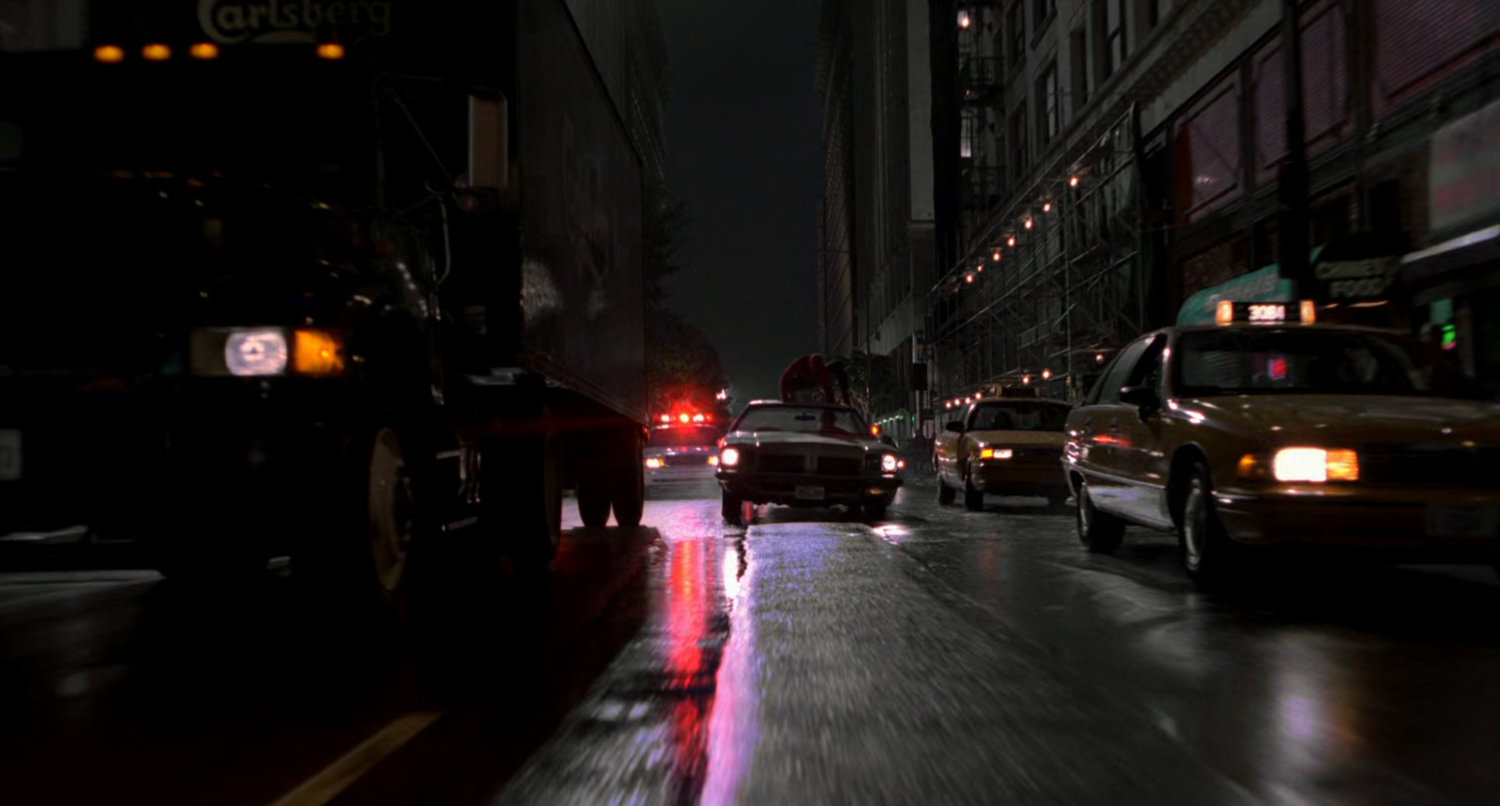Night street car chase.