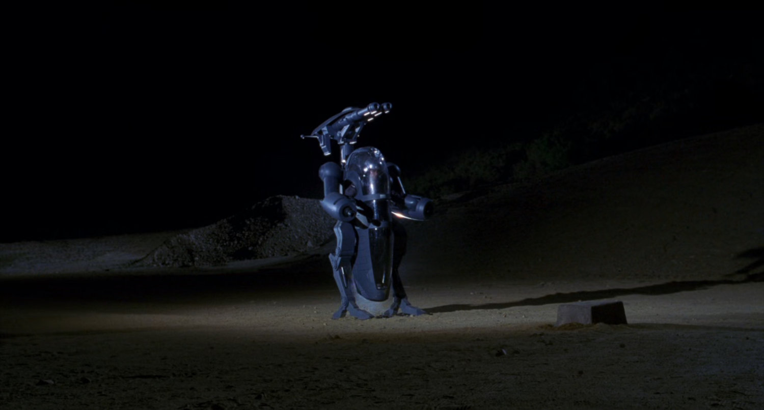 Robotic suit in desert.