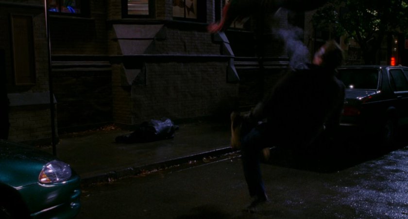 Spider-Man apprehends armored car robber.