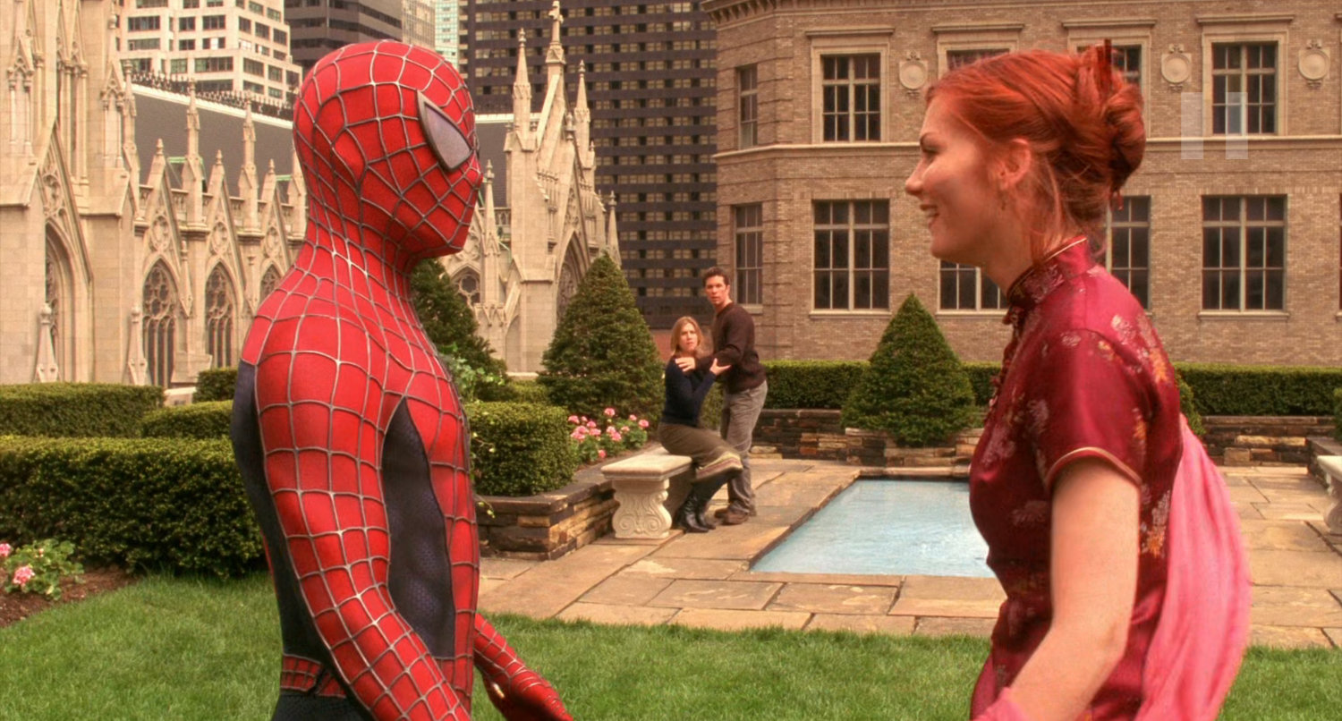 Spider-Man and Mary Jane on the Rockefeller rooftop gardens with St. Patrick's Cathedral.