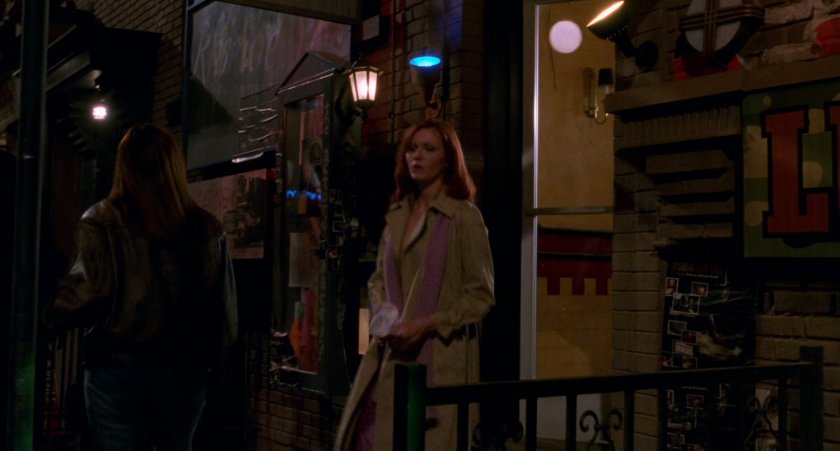 Mary Jane exits building at night.