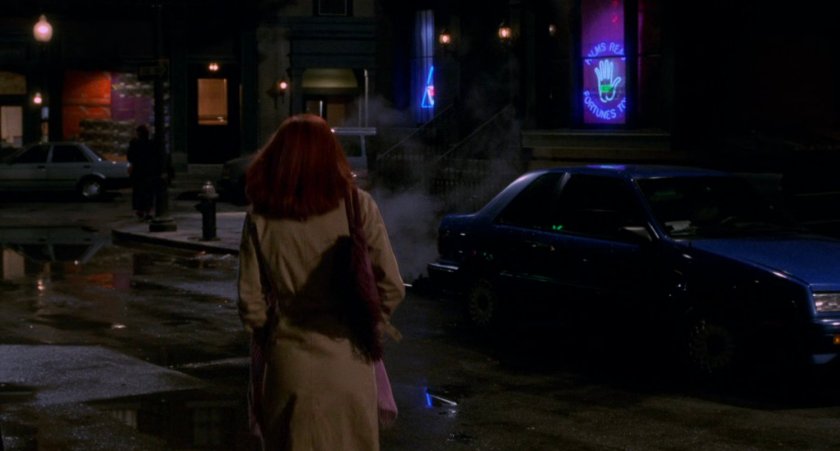 Mary Jane crosses street at night.