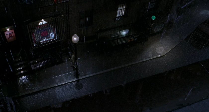 Rainy aerial view of alley at night.