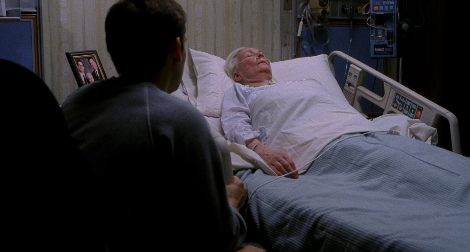 Aunt May in hospital bed.