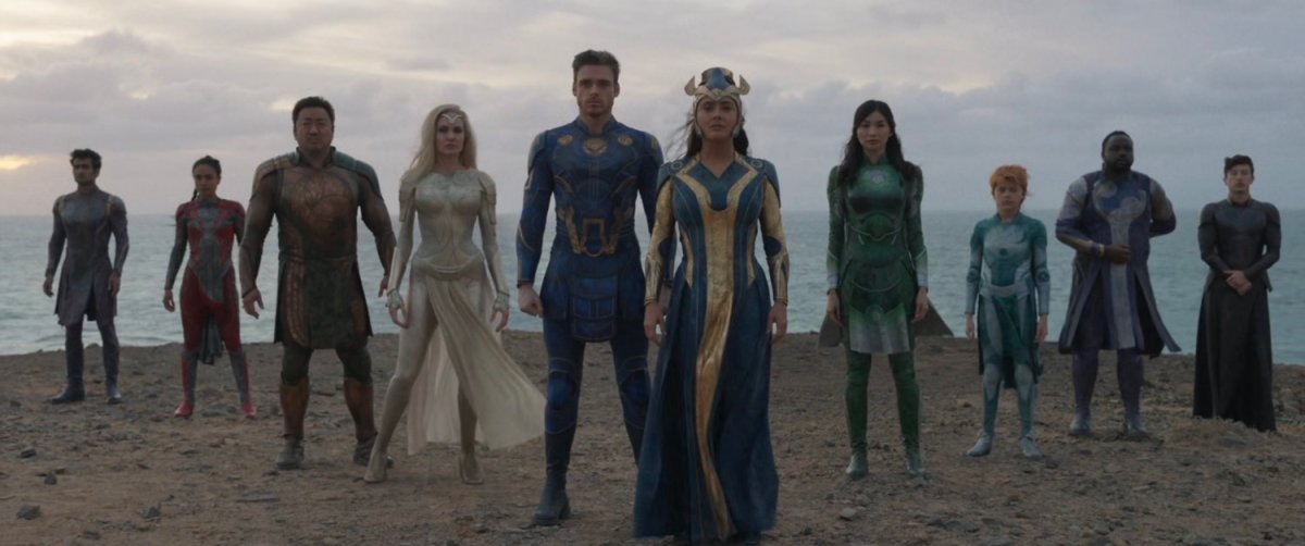 The Eternals gather on a beach.