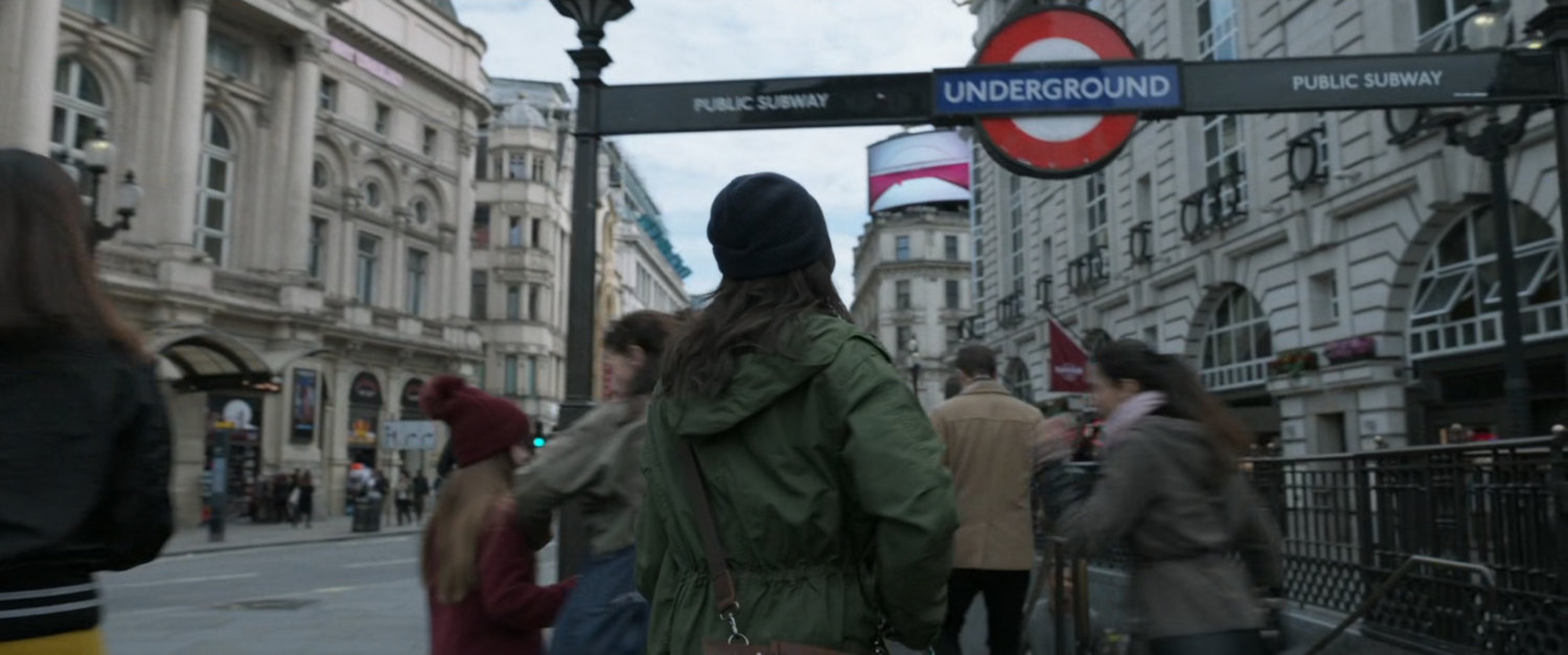 Sersi walking into the in Piccadilly Circus tube station.
