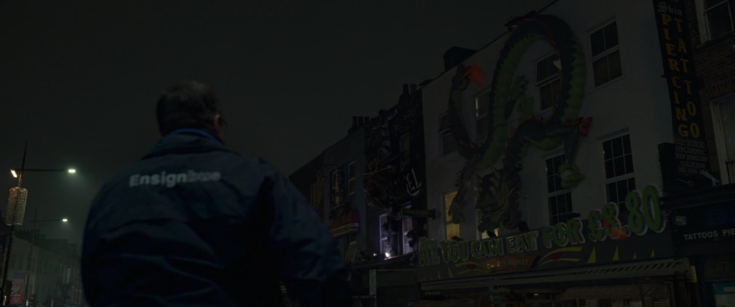 Exterior of a Camden tattoo parlor at night.