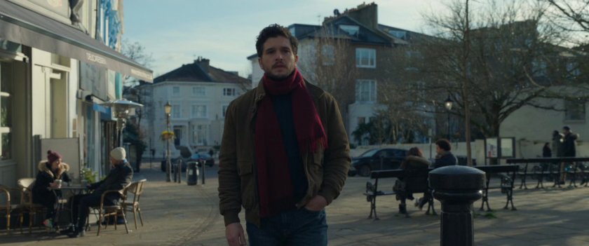 Dane on sidewalk in London square.