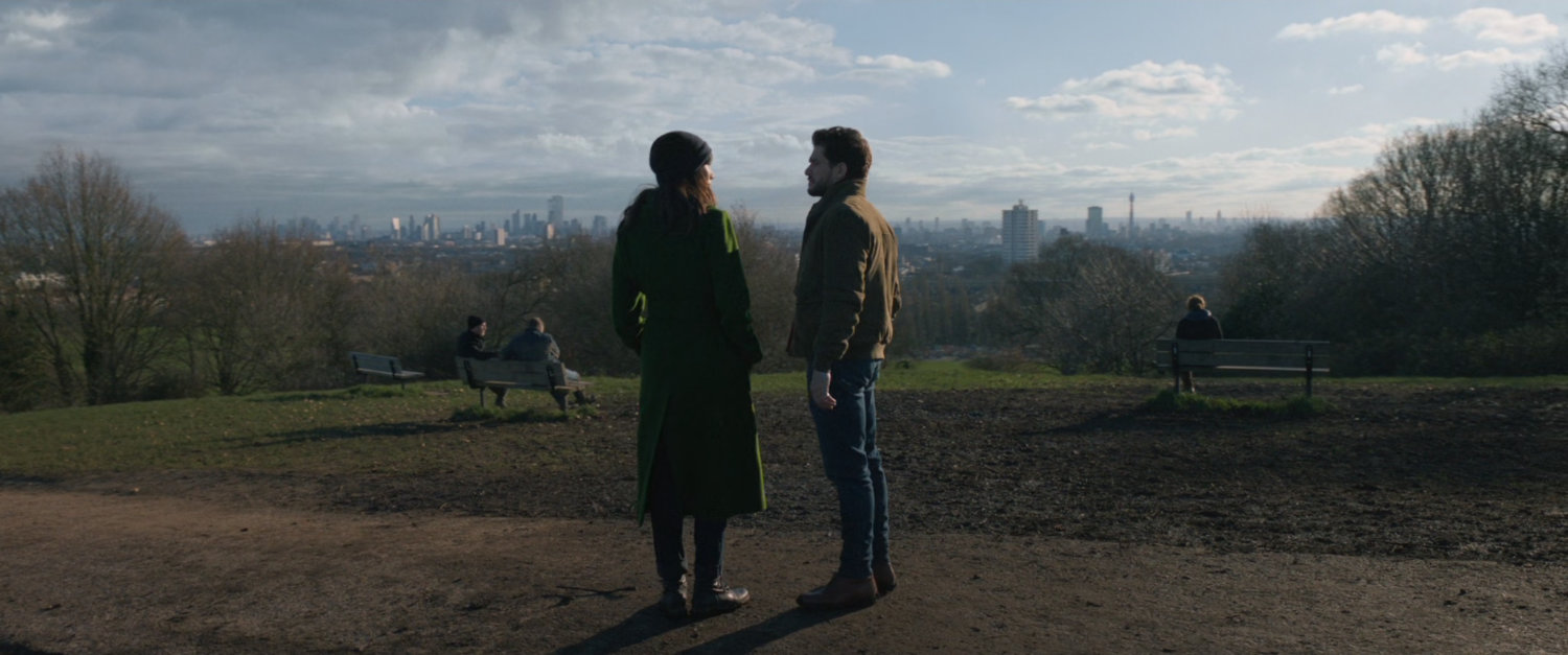 Dane and Sersi in park overlooking London.