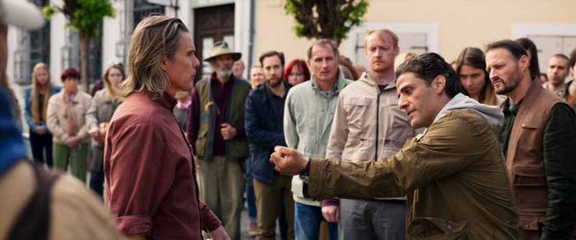 Steven shows Harrow his forearm in a German village.