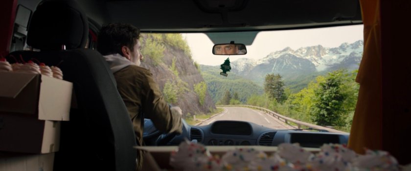 Interior of cupcake van driving down alpine road in Germany.